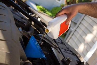 Pouring Oil in Car